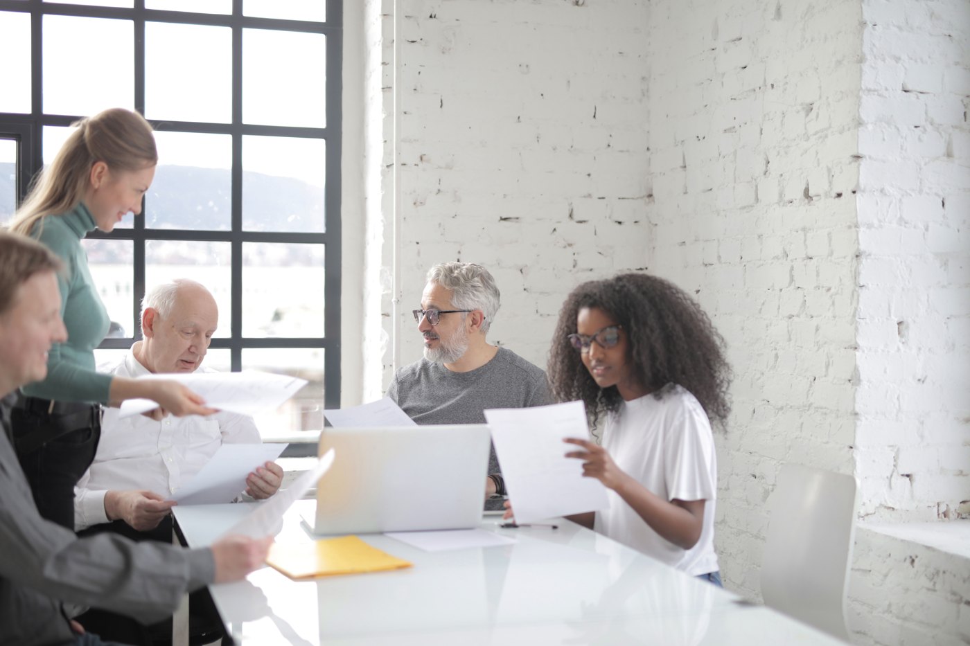 A diverse team collaborating around a meeting table